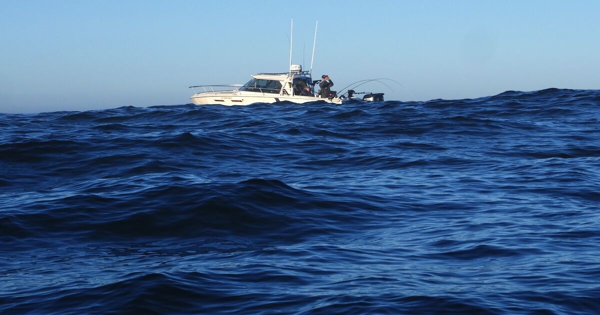 Photo: Joel Unickow boat on a wavy sea on the west coast of Vancouver Island